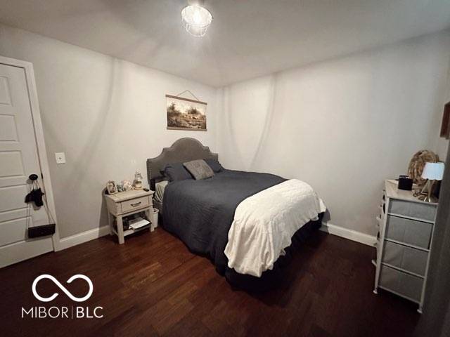 410 Hawthorn Ct, Seymour, IN 47274 - bedroom featuring wood finished floors and baseboards
