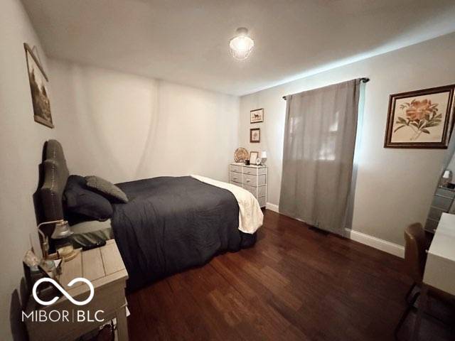 410 Hawthorn Ct, Seymour, IN 47274 - bedroom with wood finished floors and baseboards
