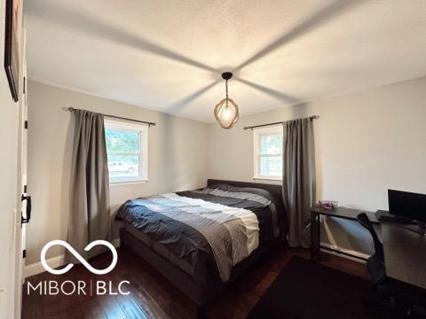 410 Hawthorn Ct, Seymour, IN 47274 - bedroom featuring multiple windows and wood finished floors