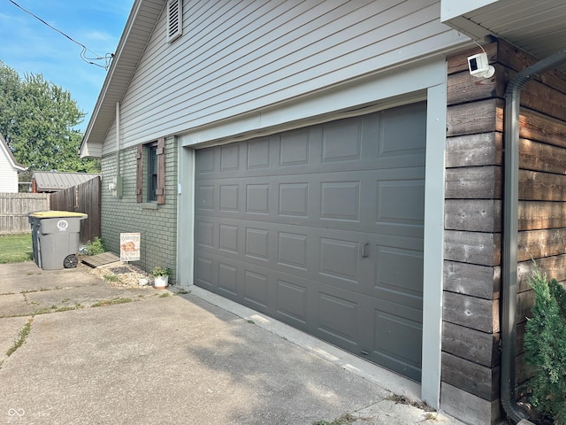 410 Hawthorn Ct, Seymour, IN 47274 - garage with concrete driveway
