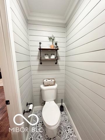 410 Hawthorn Ct, Seymour, IN 47274 - bathroom with ornamental molding and wood walls