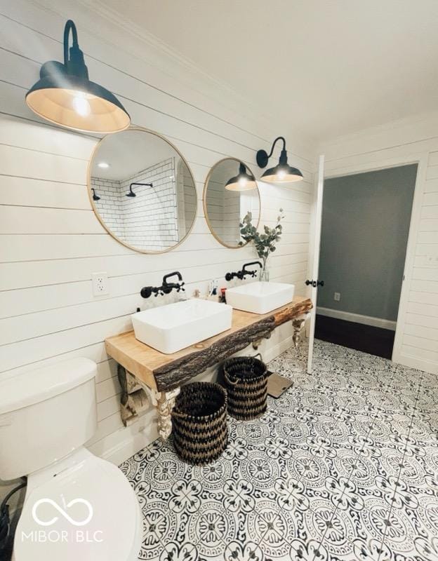 410 Hawthorn Ct, Seymour, IN 47274 - bathroom featuring wooden walls and tile patterned flooring