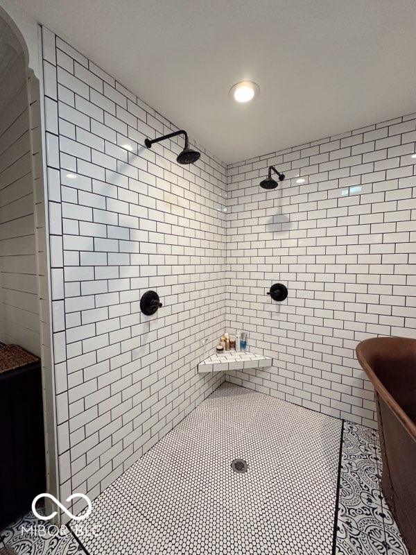 410 Hawthorn Ct, Seymour, IN 47274 - full bathroom featuring tile walls, tiled shower, a freestanding tub, and tile patterned floors