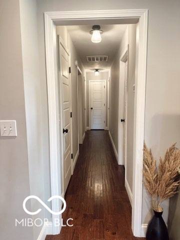 410 Hawthorn Ct, Seymour, IN 47274 - corridor with wood-type flooring and baseboards