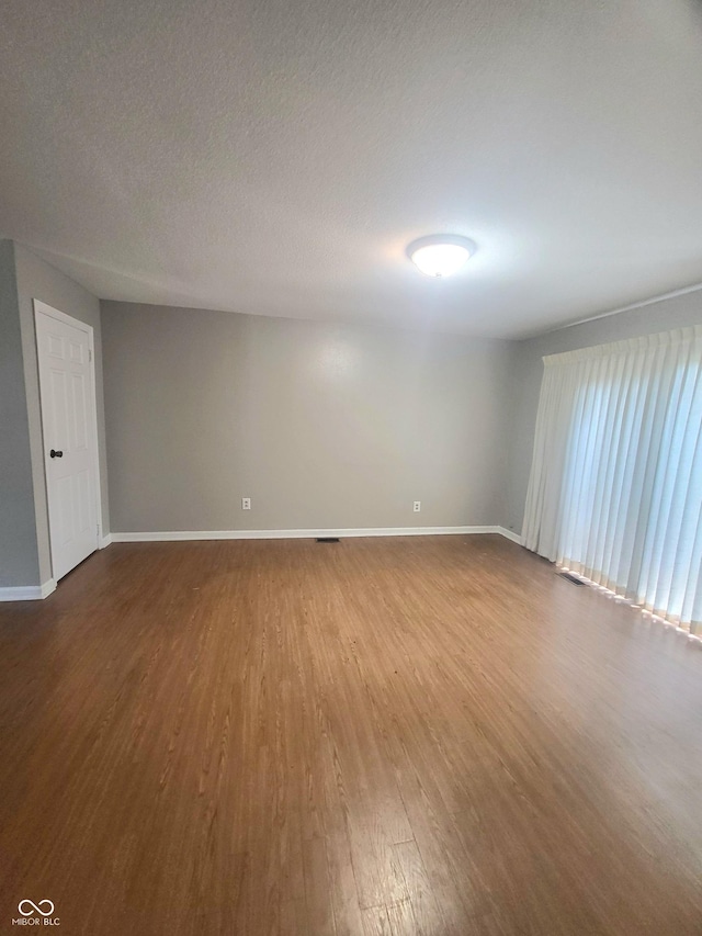 7576 S Carlisle St, Terre Haute, IN 47802 - spare room with dark wood finished floors and baseboards