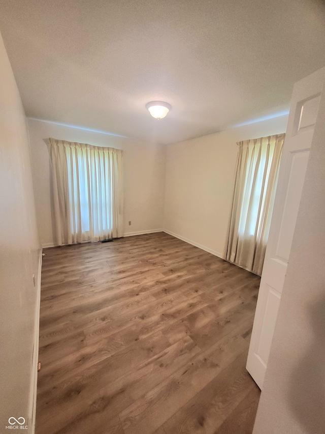 7576 S Carlisle St, Terre Haute, IN 47802 - empty room with wood finished floors