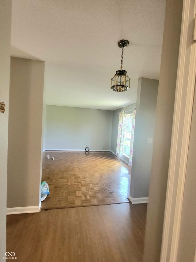 7576 S Carlisle St, Terre Haute, IN 47802 - unfurnished dining area with baseboards and parquet floors