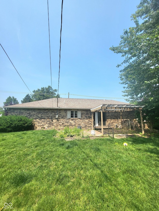 7576 S Carlisle St, Terre Haute, IN 47802 - rear view of property featuring a lawn and a pergola
