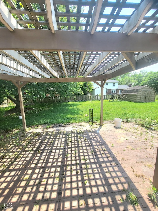 7576 S Carlisle St, Terre Haute, IN 47802 - fenced backyard with a patio, a storage unit, and a pergola