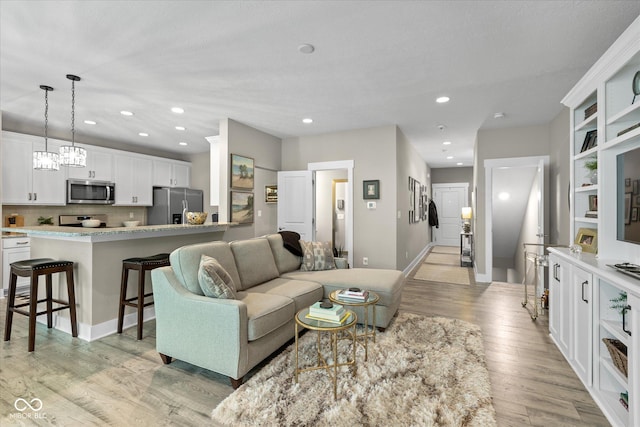 14442 Treasure Creek Ln, Fishers, IN 46038 - living area featuring light wood-style floors and recessed lighting