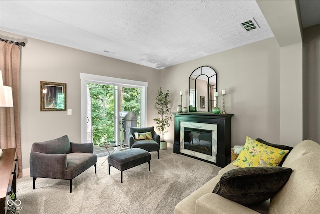 14442 Treasure Creek Ln, Fishers, IN 46038 - carpeted living room featuring a premium fireplace and a textured ceiling