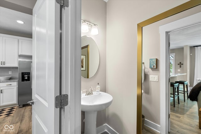 14442 Treasure Creek Ln, Fishers, IN 46038 - half bath with wood finished floors, recessed lighting, and backsplash
