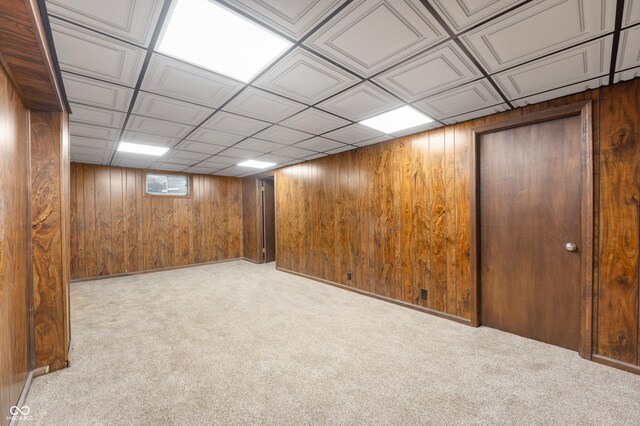8306 Corkwood Dr, Indianapolis, IN 46227 - basement with wooden walls and carpet flooring