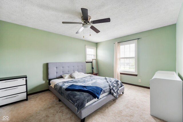 8306 Corkwood Dr, Indianapolis, IN 46227 - bedroom with carpet flooring, a ceiling fan, and a textured ceiling
