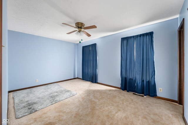 8306 Corkwood Dr, Indianapolis, IN 46227 - spare room with ceiling fan and carpet floors