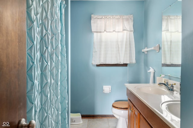 8306 Corkwood Dr, Indianapolis, IN 46227 - bathroom with double vanity, tile patterned flooring, and curtained shower