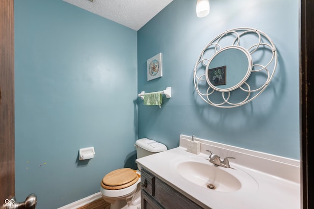 8306 Corkwood Dr, Indianapolis, IN 46227 - half bath with vanity and a textured ceiling