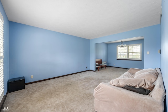 8306 Corkwood Dr, Indianapolis, IN 46227 - living room with a chandelier and carpet floors