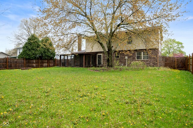 8306 Corkwood Dr, Indianapolis, IN 46227 - fenced backyard with a sunroom