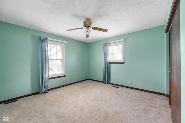 8306 Corkwood Dr, Indianapolis, IN 46227 - carpeted spare room featuring ceiling fan and a textured ceiling