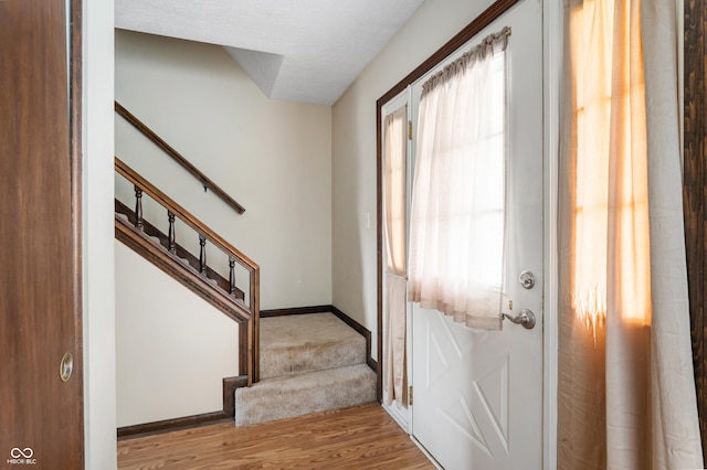 8306 Corkwood Dr, Indianapolis, IN 46227 - entryway featuring wood finished floors and stairway