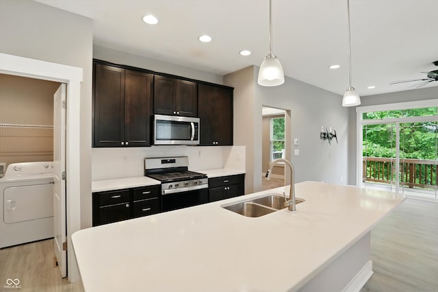 14474 Treasure Creek Ln, Fishers, IN 46038 - kitchen with stainless steel appliances, light wood-type flooring, pendant lighting, light countertops, and recessed lighting