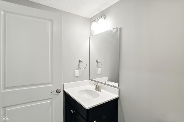 14474 Treasure Creek Ln, Fishers, IN 46038 - bathroom with vanity and a textured ceiling