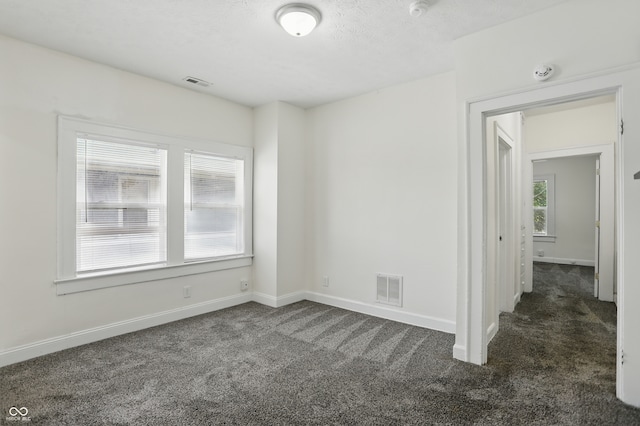 3307 N College Ave, Indianapolis, IN 46205 - carpeted spare room featuring a smoke detector