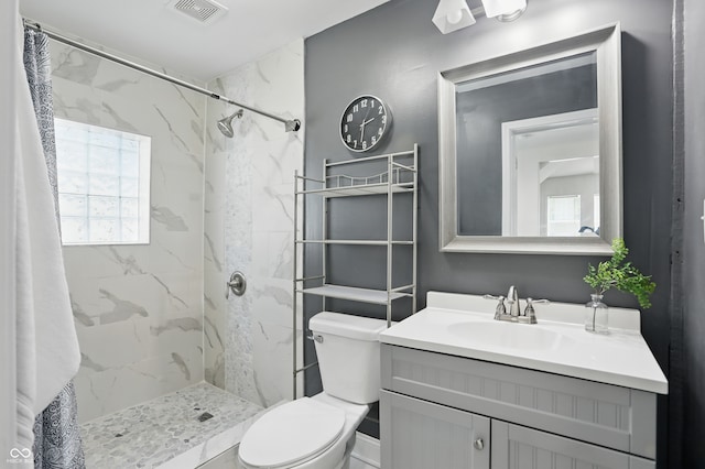 3307 N College Ave, Indianapolis, IN 46205 - full bathroom with vanity, healthy amount of natural light, and a marble finish shower