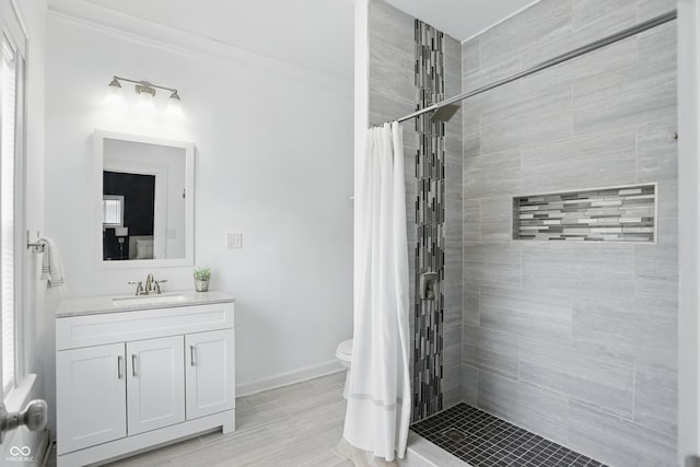 3307 N College Ave, Indianapolis, IN 46205 - full bathroom with vanity, tiled shower, and ornamental molding
