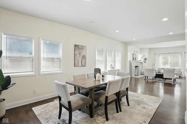 3307 N College Ave, Indianapolis, IN 46205 - dining area with dark wood-style flooring, recessed lighting, and a fireplace with raised hearth