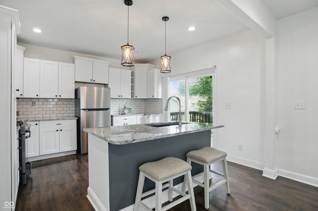 3307 N College Ave, Indianapolis, IN 46205 - kitchen with freestanding refrigerator, dark wood finished floors, decorative backsplash, light stone counters, and recessed lighting