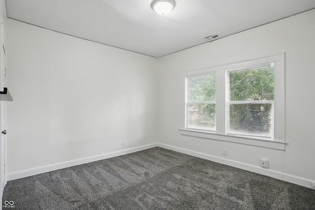 3307 N College Ave, Indianapolis, IN 46205 - unfurnished room with dark carpet and baseboards