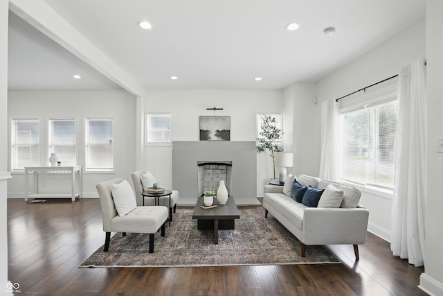 3307 N College Ave, Indianapolis, IN 46205 - living area featuring a fireplace with raised hearth, dark wood-style floors, and recessed lighting
