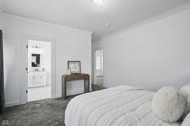 3307 N College Ave, Indianapolis, IN 46205 - bedroom with crown molding, dark carpet, and connected bathroom