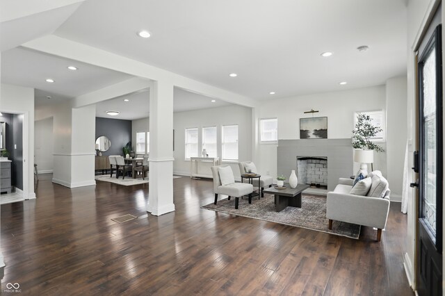 3307 N College Ave, Indianapolis, IN 46205 - living room with a fireplace, wood finished floors, recessed lighting, and ornate columns