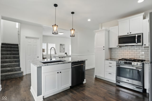 3307 N College Ave, Indianapolis, IN 46205 - kitchen featuring appliances with stainless steel finishes, recessed lighting, light stone countertops, white cabinets, and tasteful backsplash