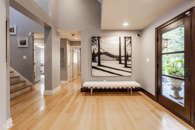 8651 Emerald Ln, Indianapolis, IN 46260 - entrance foyer featuring light wood finished floors, stairway, and recessed lighting