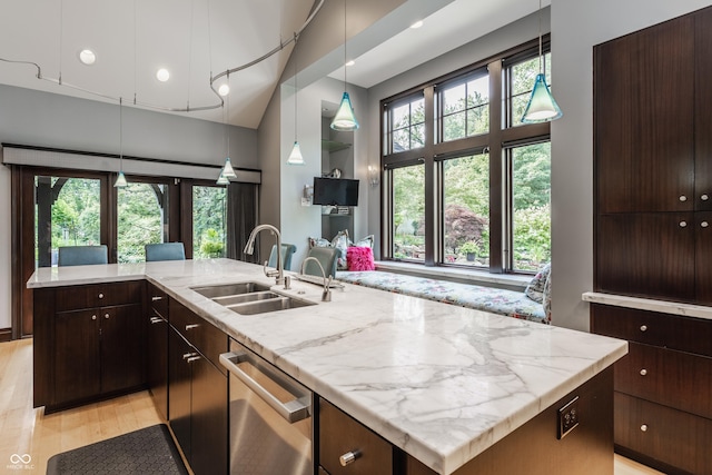 8651 Emerald Ln, Indianapolis, IN 46260 - kitchen featuring dishwasher, light stone counters, dark brown cabinets, pendant lighting, and recessed lighting