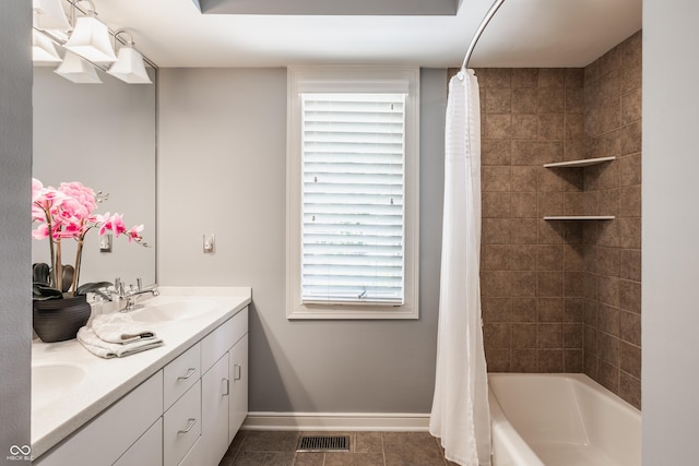 8651 Emerald Ln, Indianapolis, IN 46260 - bathroom with double vanity, shower / bath combo with shower curtain, and tile patterned flooring