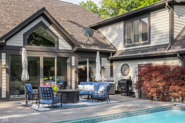 8651 Emerald Ln, Indianapolis, IN 46260 - back of house with an outdoor hangout area, a patio area, an outdoor pool, and roof with shingles