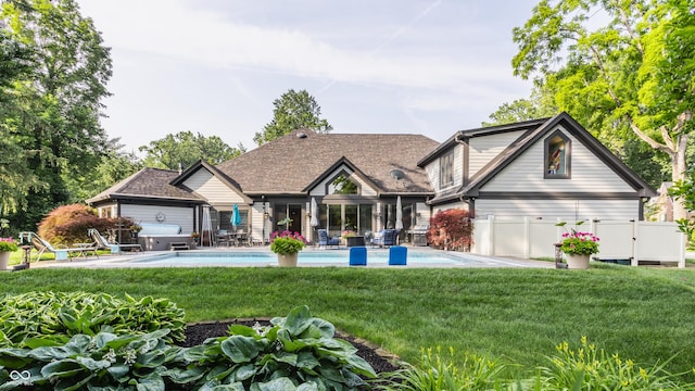8651 Emerald Ln, Indianapolis, IN 46260 - back of property with an outdoor pool and a patio