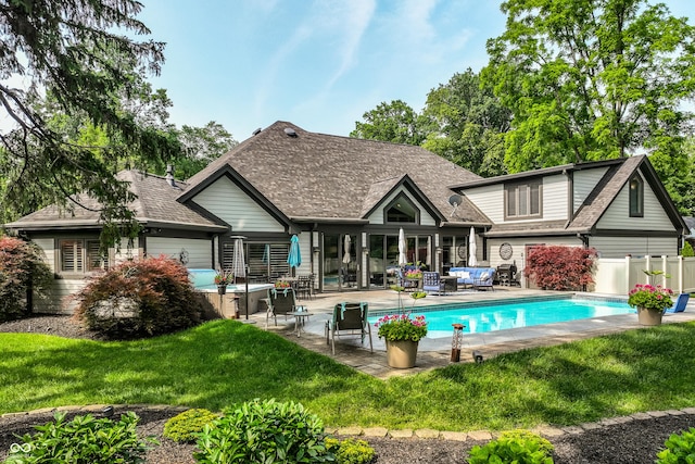 8651 Emerald Ln, Indianapolis, IN 46260 - back of property featuring an outdoor hangout area, an outdoor pool, a patio area, and a shingled roof