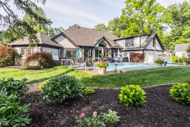 8651 Emerald Ln, Indianapolis, IN 46260 - rear view of property featuring a yard, an outdoor pool, and a patio