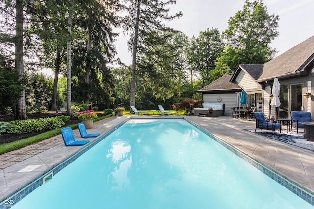 8651 Emerald Ln, Indianapolis, IN 46260 - swimming pool featuring a patio and view of scattered trees