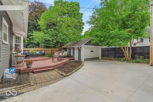 4732 N Kenwood Ave, Indianapolis, IN 46208 - view of patio with a wooden deck, an outdoor structure, and a detached garage