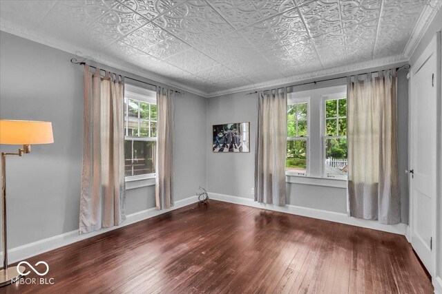 4732 N Kenwood Ave, Indianapolis, IN 46208 - empty room featuring hardwood / wood-style flooring and an ornate ceiling