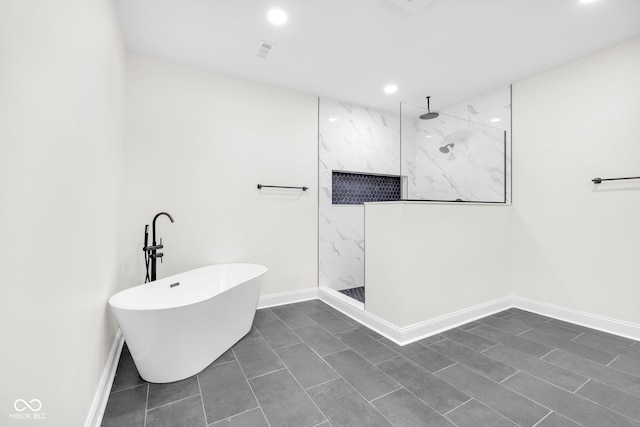 2031 Central Ave, Indianapolis, IN 46202 - bathroom featuring a marble finish shower, recessed lighting, and a freestanding tub