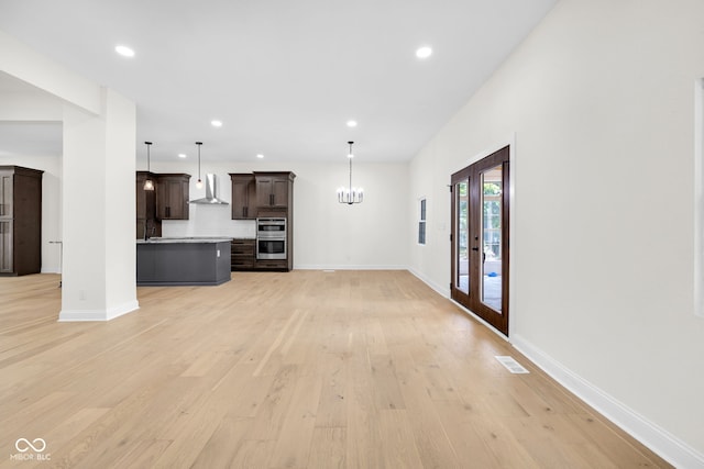 2031 Central Ave, Indianapolis, IN 46202 - unfurnished living room featuring recessed lighting, light wood-type flooring, and a chandelier