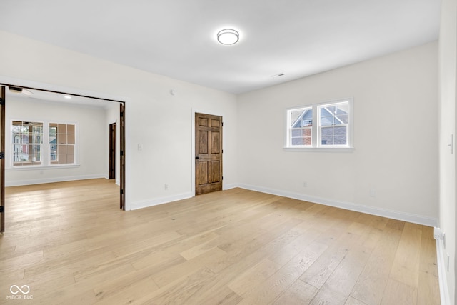 2031 Central Ave, Indianapolis, IN 46202 - unfurnished bedroom featuring light wood finished floors and multiple windows